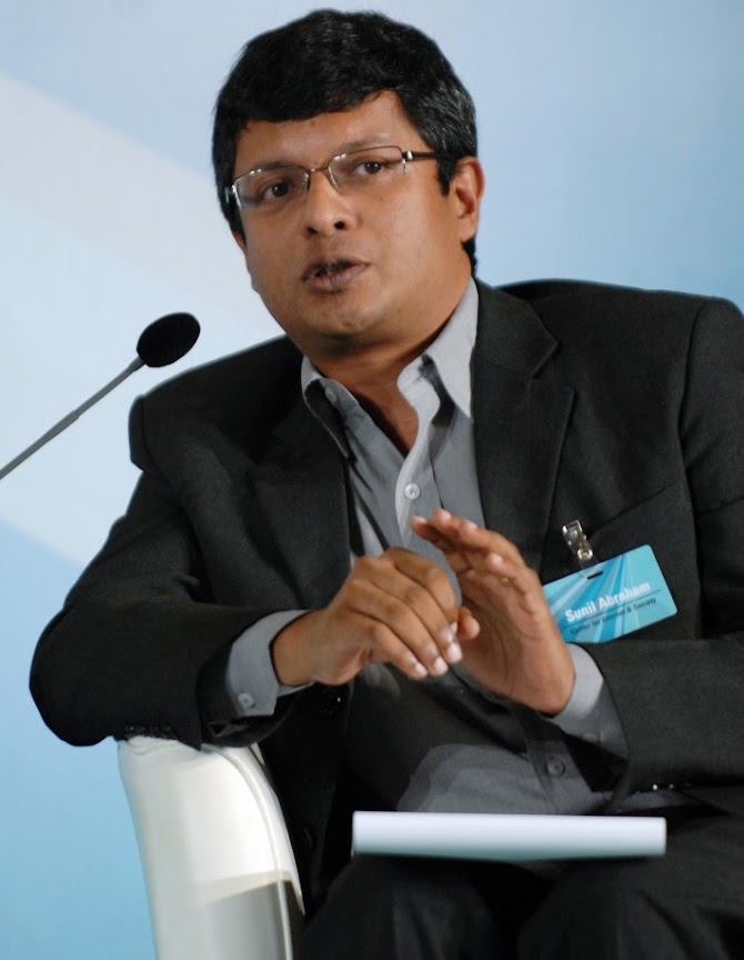 Sunil Abraham in 2001, wearing black coat, speaking